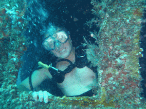 Scuba Diving in Barbados' Carlisle Bay Marine Park Diver in the wheelhouse of the Eilion
